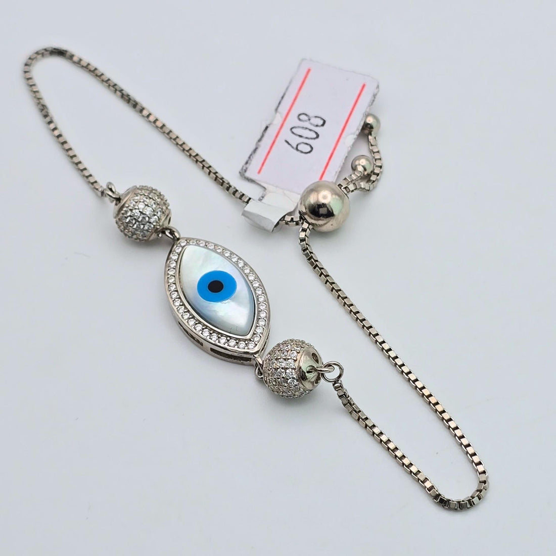 925 silver mother of pearl evil eye bolo bracelet, sterling silver adjustable box chain Nazar bracelet for women, sparkling crystal halo protection jewelry, iridescent blue eye charm bracelet Canada USA