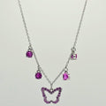 Necklace with a butterfly pendant and purple gemstones on a light gray background
