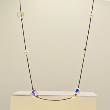 Necklace with colorful beads on a light gray background