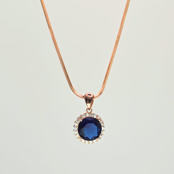 Necklace with a blue pendant on a light gray background