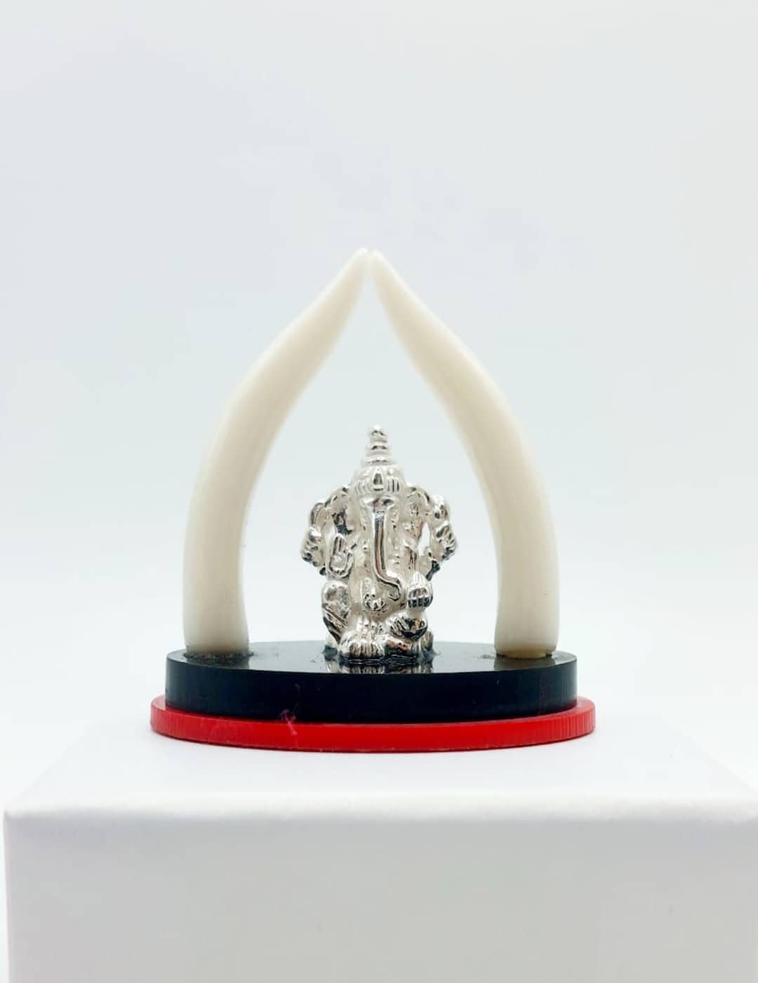 Handcrafted Little Ganesha silver idol with two white tusks, perfect for home decor and gifting.