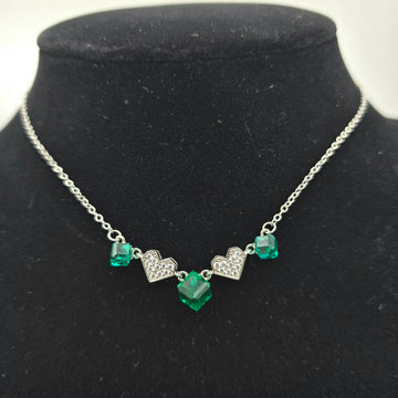 925 silver necklace for women featuring alternating green emerald-cut crystals and pavé heart stations on a real silver chain.