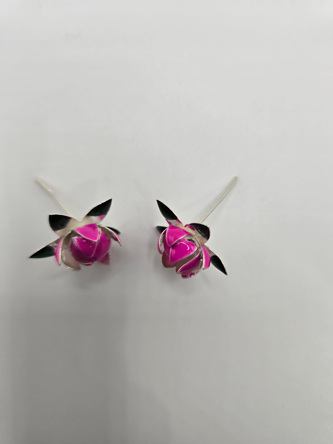Handcrafted real silver lotus buds with pink enamel on long stems for puja thali decor and luxury return gifts
