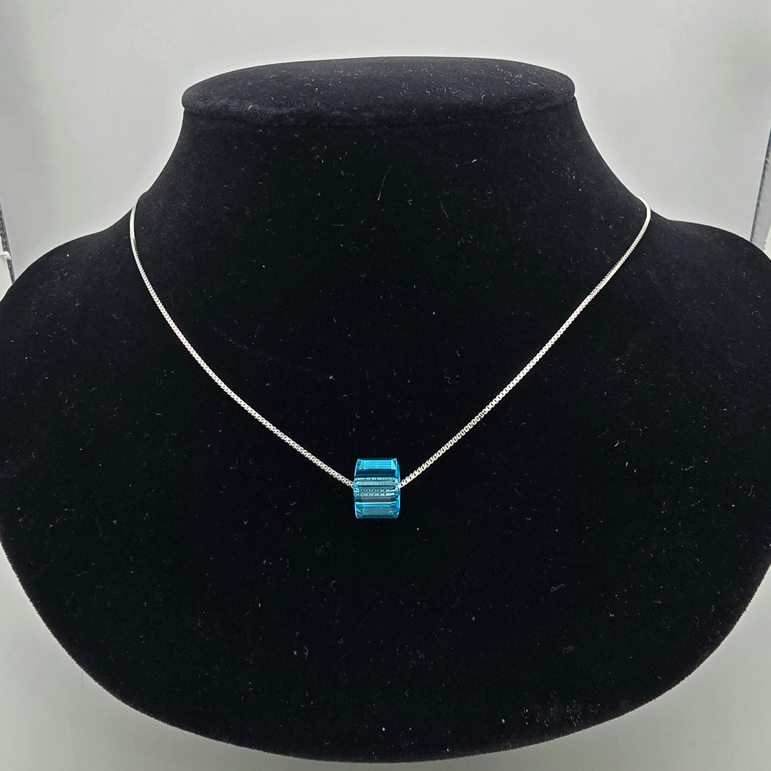 925 silver necklace for women featuring a minimalist vibrant blue cube slide pendant on a fine real silver box chain.