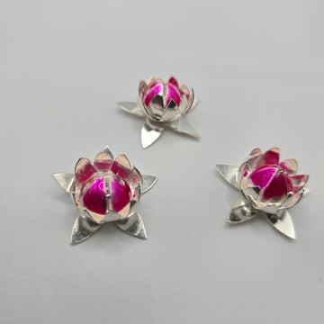 Handcrafted real silver lotus flower buds with vibrant pink enamel for puja decor and luxury return gifts