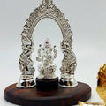 Silver Ganesha statue with elephant arch design, handcrafted Hindu home decor